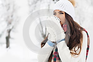 Attractive young woman in wintertime outdoor