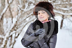 Attractive young woman in wintertime outdoor