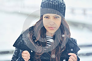 Attractive young woman in wintertime outdoor