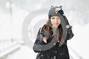 Attractive young woman in wintertime outdoor