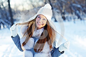 Attractive young woman in wintertime outdoor