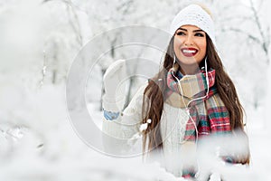 Attractive young woman in wintertime outdoor photo