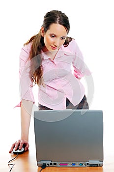 Attractive young woman working on the computer