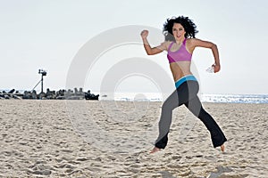 Atttractive woman working out on beach