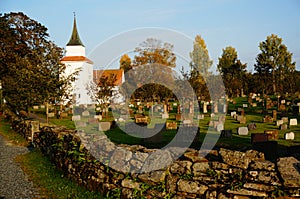 Atumn on norwegian cemetery and church, Norway photo
