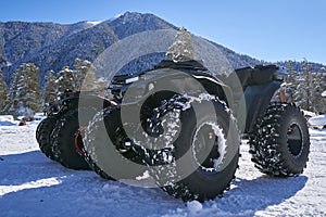 ATV with big wheels on the snow