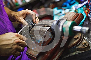 ATV constant-velocity CV joint repair by hands in old garage