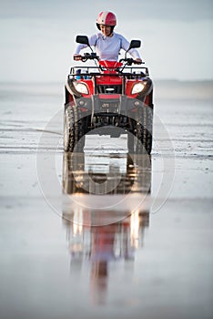 ATV driver on the beach