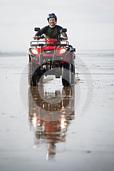 ATV driver on the beach