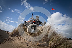 ATV on grassy sand dune photo