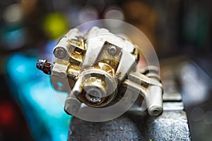 ATV hydraulic disc brake caliper system repair in old garage