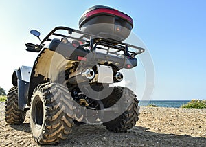 ATV offroad on sea and sky background