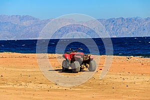 ATV quad bike for safari trips on shore of the Red Sea in the Gulf of Aqaba. Dahab, Egypt