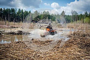 Atv rider in muddy water. Xtreme utv ride