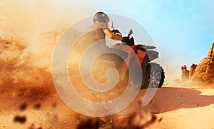 Atv riding in sand quarry, dust clouds, quad bike