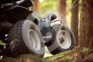 ATV's parked in the parking lot in the forest. good weather.