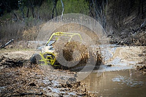 ATV and UTV offroad vehicle racing in hard track with mud splash. Extreme, adrenalin. 4x4