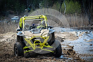 ATV and UTV offroad vehicle racing in hard track with mud splash. Extreme, adrenalin. 4x4