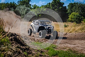 ATV and UTV riding in sandy dusty track. Amateur competitions. 4x4