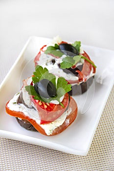 Aubergine appetizer with fresh tomato and cream cheese