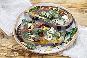Aubergine with goat cheese and crispy kale