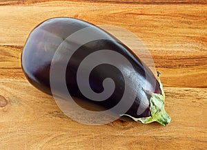 Aubergine, Indian purple eggplant on wood