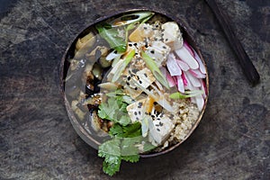 Aubergine, quinoa and tofu in coconut bowl