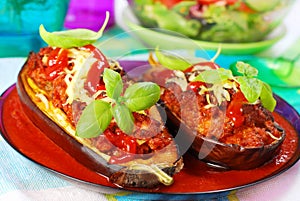 Aubergine stuffed with meat in tomato sauce