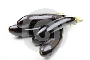 Aubergines, Solanum melongena, on white ground