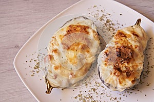 Aubergines stuffed with bacon, tuna, ham, cheese and bechamel
