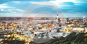 Auckland skyline from Mount Eden after sunset during blue hour - New Zealand modern city with spectacular nightscape panorama -