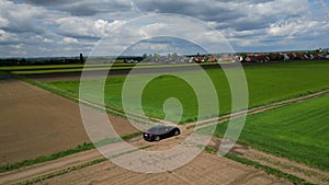 Audi A4 driving in a field 4K drone