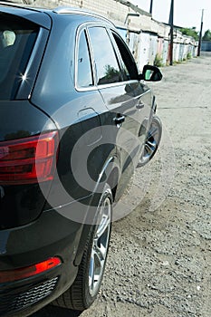 AUDI Q3 in black. Subcompact luxury crossover Audi Q3. Detailing. Headlight type