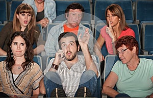 Audience Angry With Man on Phone