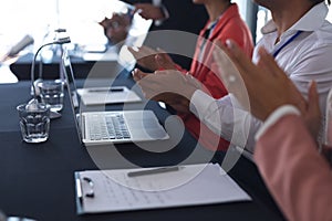 Audience applauding in a business seminar