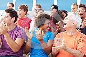 Audience Applauding At Outdoor Concert Performance