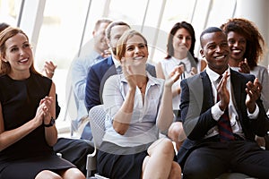 Audience Applauding Speaker At Business Conference