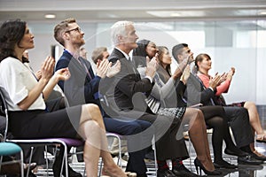 Audience Applauding Speaker After Conference Presentation