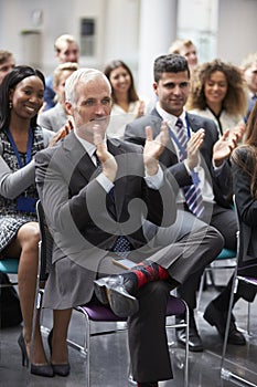 Audience Applauding Speaker After Conference Presentation