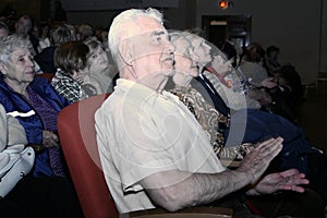 The audience and the audience are retired, elderly world war II veterans and their relatives.