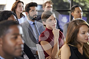 Audience at a business seminar listening to a speaker