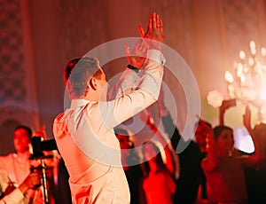 Audience couple watching concert stage stand back