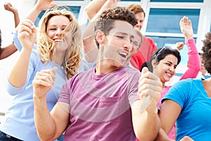 Audience Dancing At Outdoor Concert Performance