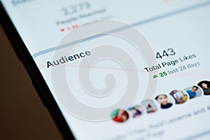 Audience on facebook page on smartphone screen