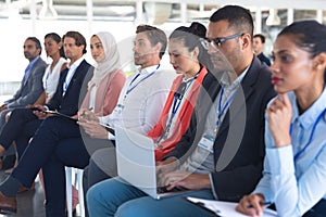 Audience listening to speaker in a business seminar