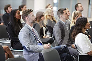 Audience Listening To Speaker At Conference Presentation