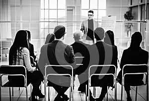 Audience listens to the lecturer in the conference room