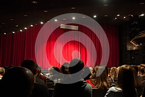 Audience in theater waiting for play to start