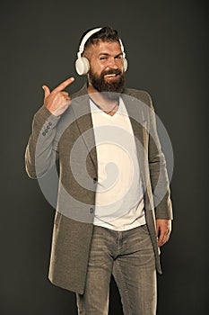 Audio book. Application for listening books. Lifestyle music fan. Man listening music wireless headphones. Hipster use