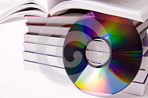 Audio book concept - pile of books and one cd